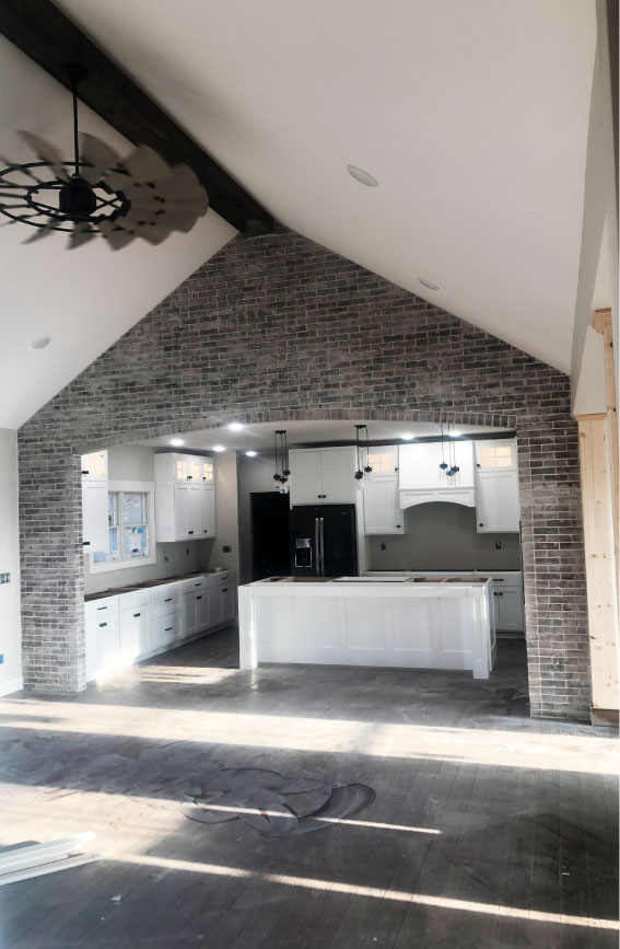 finished gray thin brick interior wall and archway