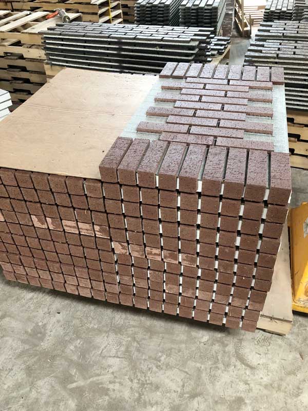 pallet of prefab thin brick panels ready for installation