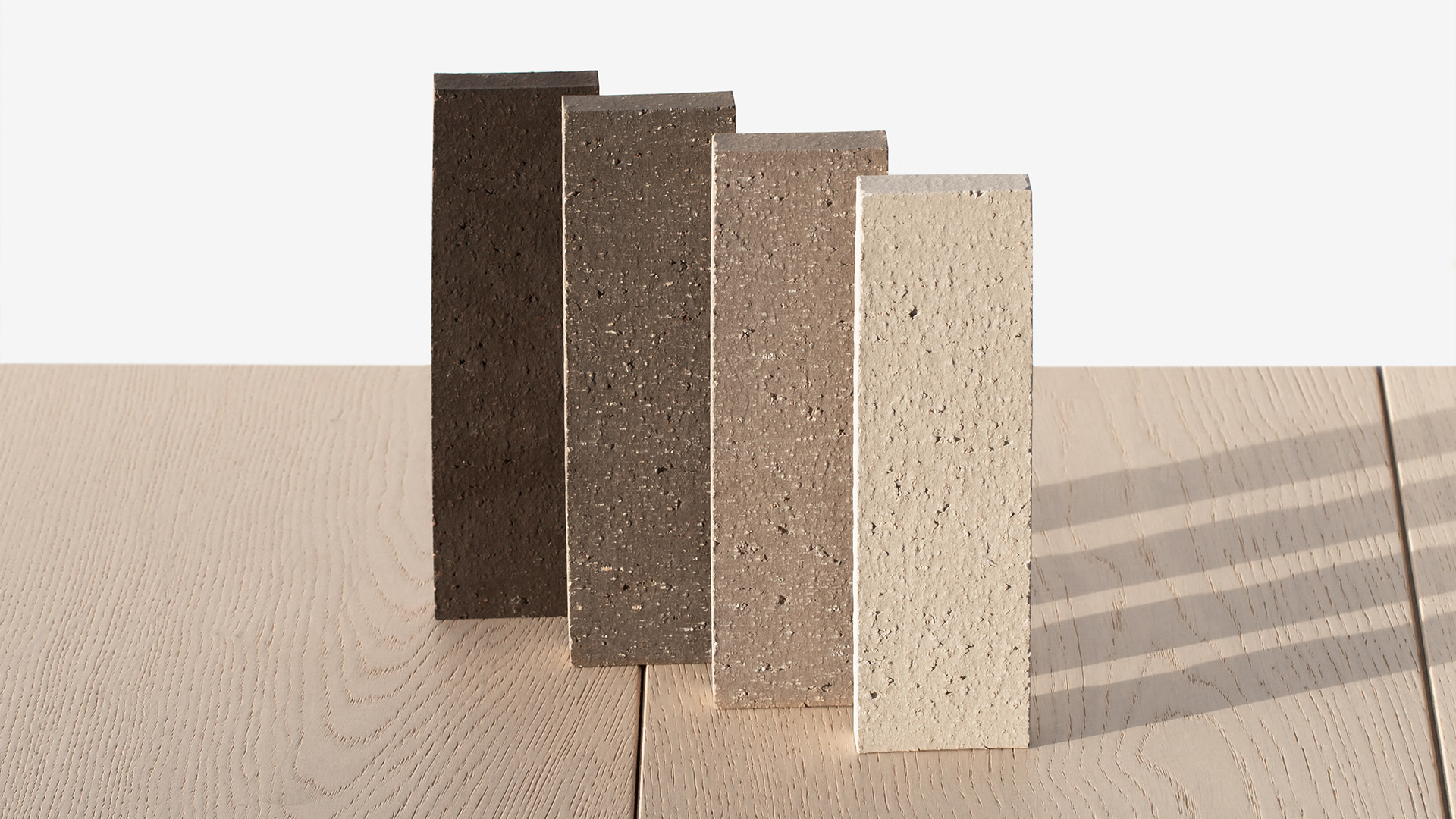 Promotional photo of a stack of four EVOLUTION thin brick colors